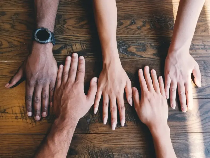 Hands working together