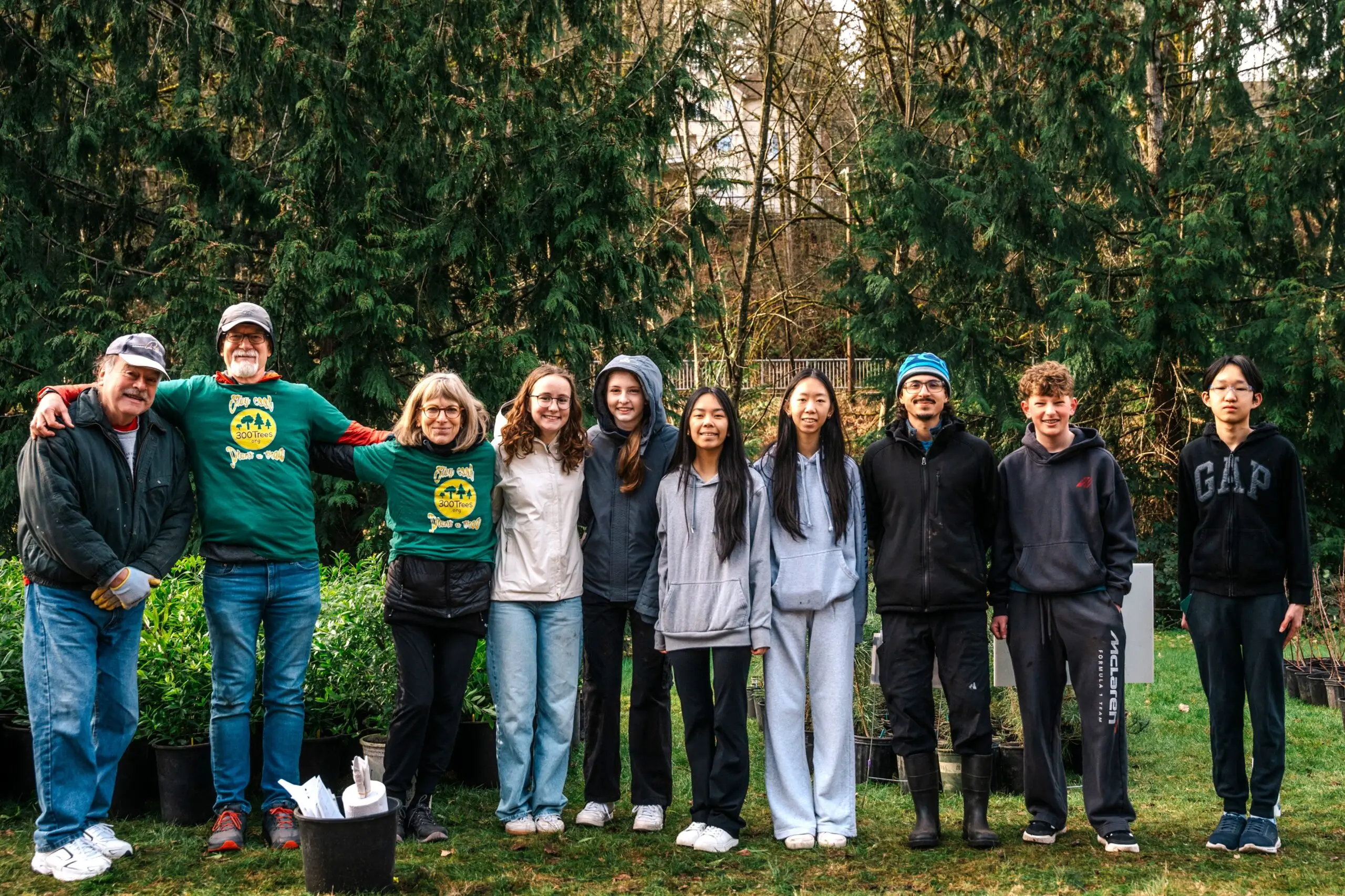A group of 300Trees volunteers standing together at the giveaway event